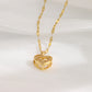 C48 - Golden necklace with heart pendant